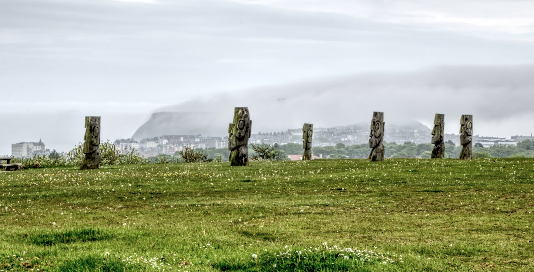 Easter Island statues with misty Scarborough in the background